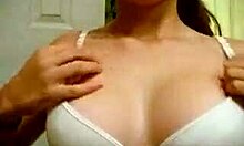 cheerful gal proudly displaying her cute features in the mirror