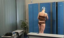 blond-haired babe reveals long legs in voyeur striptease