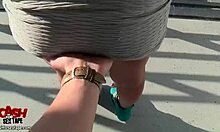 Fella takes photos of chick during outdoor activity.