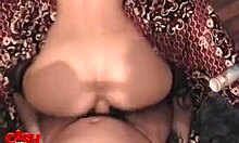 Seductive doll models red outfit, stockings accentuating petite frame.