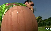 oily chick shows off her big shaved pussy lips posing