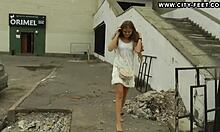 Beautiful teen walks barefoot with colorful nails