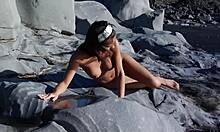 This athletic brunette climbs sharp rocks completely naked, showing off her perfect body.