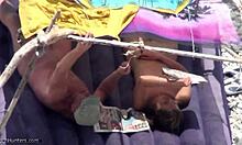 Stunning high-quality amateur voyeur video captures naked milf on beach
