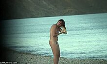 Perky ass brunette flashes her tits and pussy on the beach for hidden cam voyeurs.