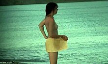 Perky ass brunette flashes her tits and pussy on the beach for hidden cam voyeurs.