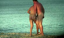 Perky ass brunette flashes her tits and pussy on the beach for hidden cam voyeurs.