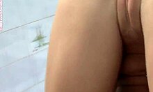 hey, check this horny blonde fucking a toy outdoors in bikini