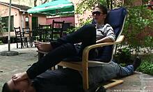 shades-wearing chick just shoves her whole foot right in his mouth