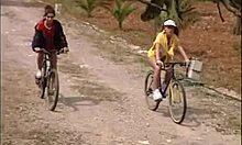 Two Gorgeous Girlfriends Biking Outdoors While Half-Naked