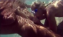 Underwater Hardcore Sparks a Wild FFM Threesome on Wet Sand.