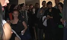 Watch this tanned brunette get fucked upside down in front of the crowd