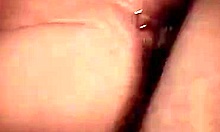 Dress-wearing brunette sucks cock then gets doggystyle on cam