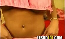 Tanned brunette in pink showing off her killer curves on a red bed, stripping as a teen 18+ solo.