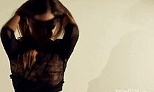 Brunette Model in Bodysuit and Black Boots Dances by Spotlight