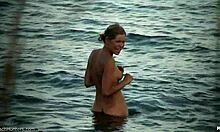 slender blonde girlfriend posing naked in the water