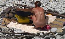 Tanned blonde with short hair reveals her naked body while rubbing him.