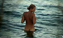 slender blonde girlfriend posing naked in the water