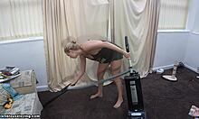 Blonde housewife cleans floor exposing her big boobs