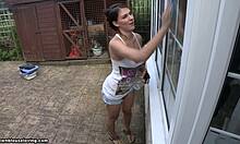 damn, this tanned brunette flashes her big tits outside