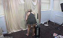 Blonde housewife cleans floor exposing her big boobs