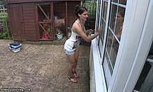 damn, this tanned brunette flashes her big tits outside