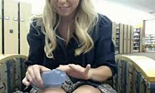 Wavy-haired blonde fingers her tight slit in the library.