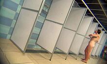 Hidden camera catches a stunning brunette MILF in steamy shower scene