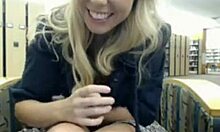 Wavy-haired blonde fingers her tight slit in the library.