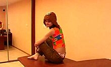 colorfully dressed young girl shows pussy and feet