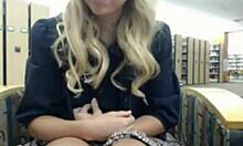 Wavy-haired blonde fingers her tight slit in the library.