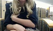 Wavy-haired blonde fingers her tight slit in the library.