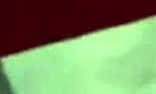 Dark-haired babe in a revealing bikini shows off her butt