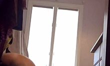 Check out this blonde milf in red panties showing her big tits on cam