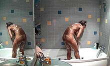 Slim brunette bathes naked in bathroom