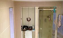 showering brunette showcases her beautiful pale breasts on cam