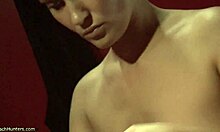 Dark-haired babe in a revealing bikini shows off her butt