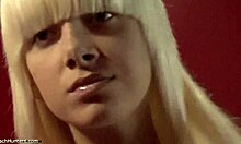 Blonde shows naked body.