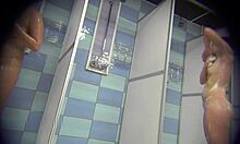 girlfriend in one-piece swimsuit strips for hidden shower cam