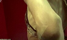 blond-haired naked girl shows her perfect body in the bathroom