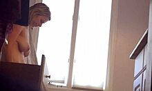 Check out this blonde milf in red panties showing her big tits on cam