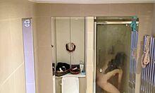 showering brunette showcases her beautiful pale breasts on cam