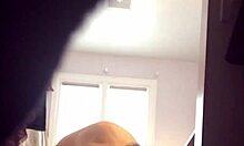 Check out this blonde milf in red panties showing her big tits on cam