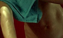 Petite blonde in provocative bikini checks herself out