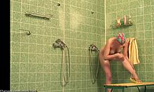 i caught this busty babe shaving her long legs in shower