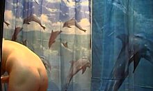 tender brunette babe rubs naked body in warm shower spied on