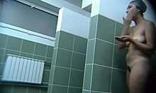 Chubby mature hottie washing huge tits caught on hidden cam