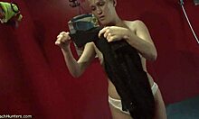 Beautiful brunette likes to watch herself undressing through the mirror