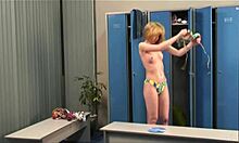 Skinny blonde slips into a seductive bikini in the changing room. Is she alone?