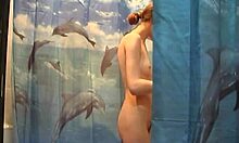 i watch this soapy naked skinny blonde chick having fun in the shower with her wet shaved pussy, it's so hot